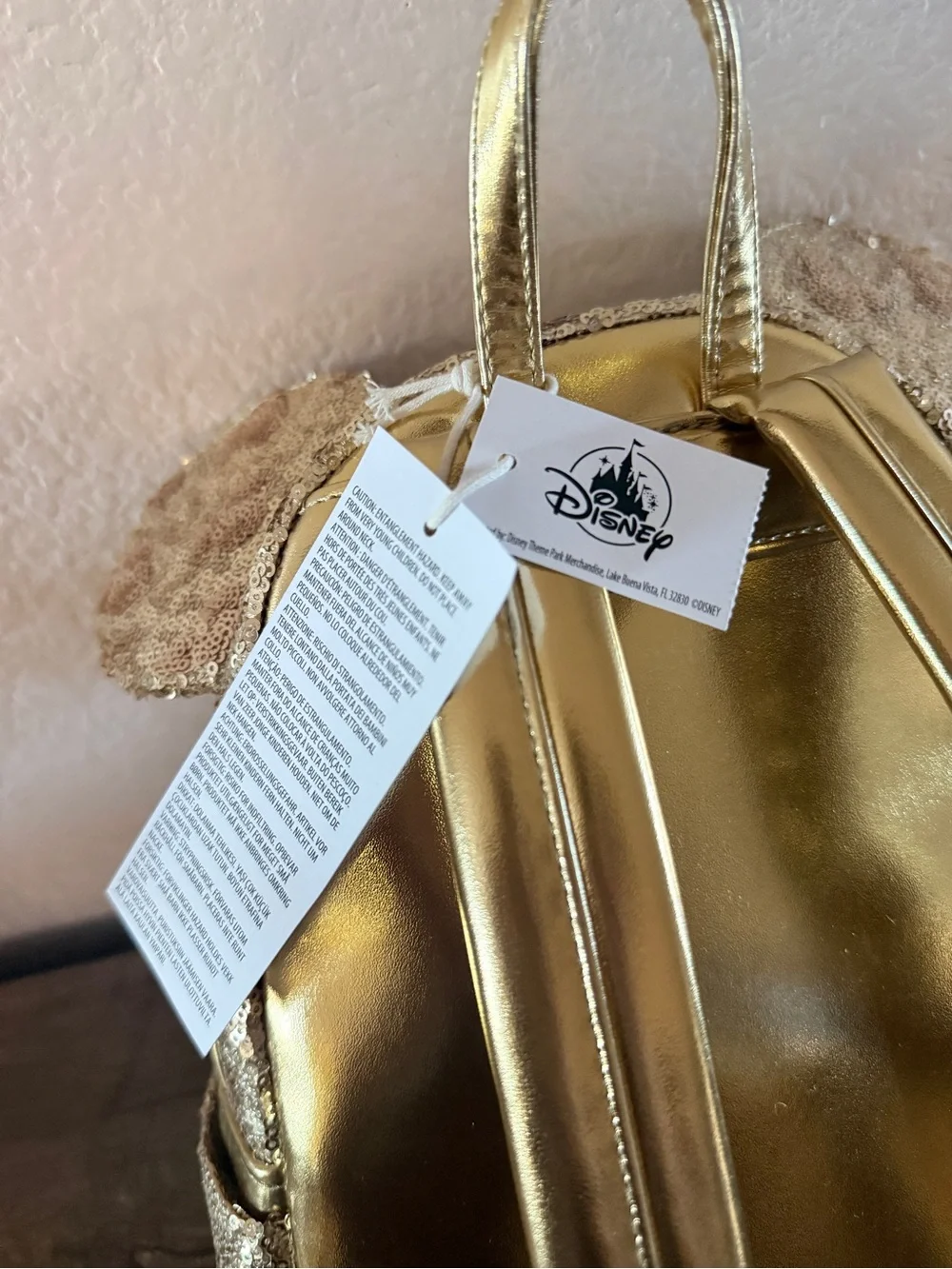 Loungefly Disney gold sequin backpack with hidden mickeys
